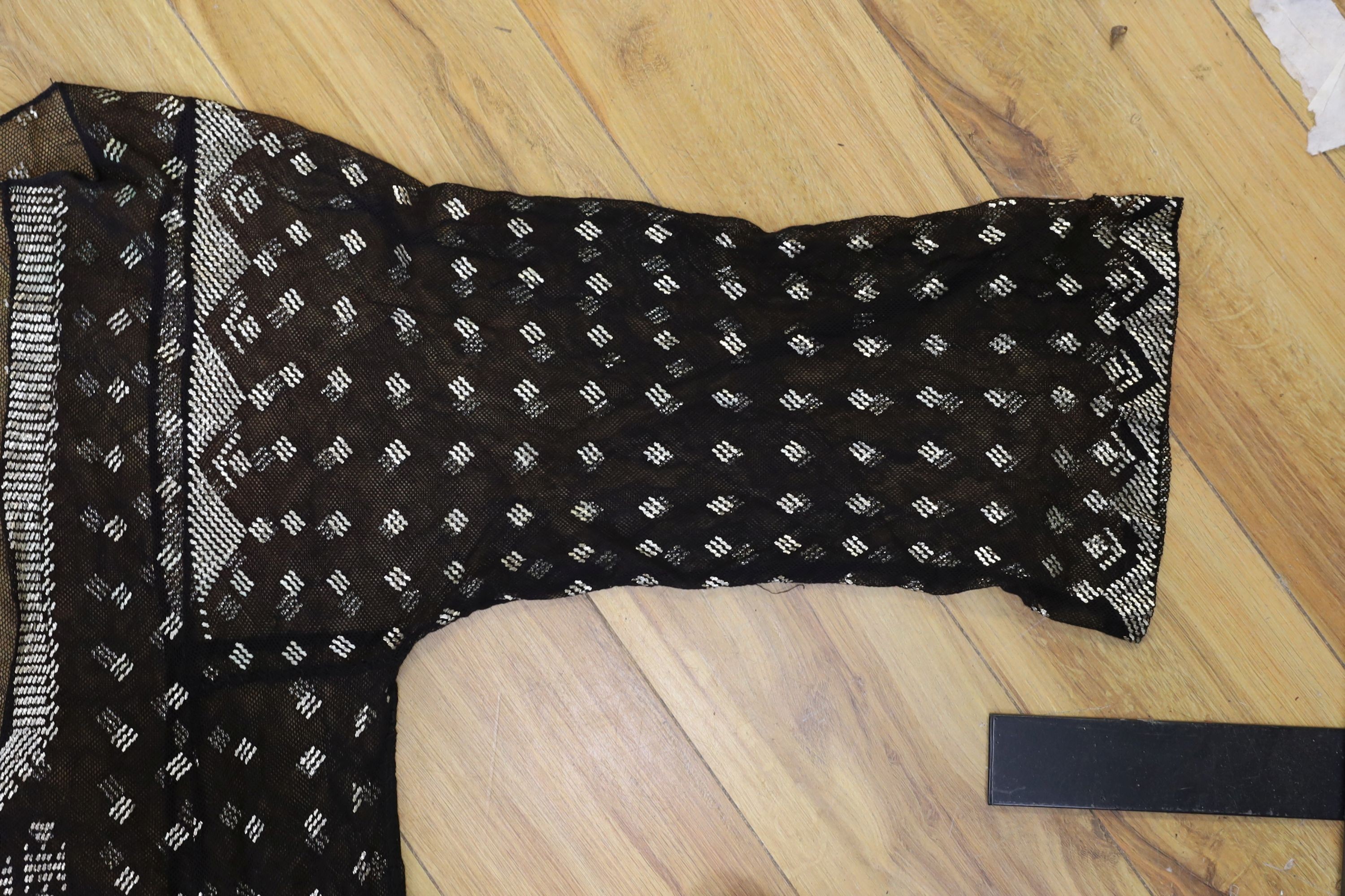 A dress made from a metal and black net Egyptian shawl; a similar shawl and a piece of shawl